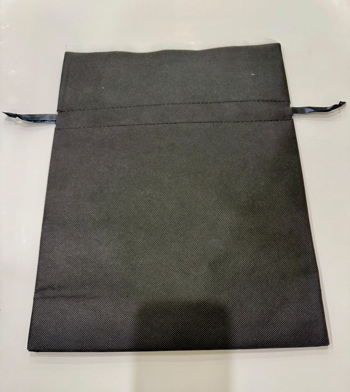 Double edge cotton gift bag with drawstring closure in natural beige color