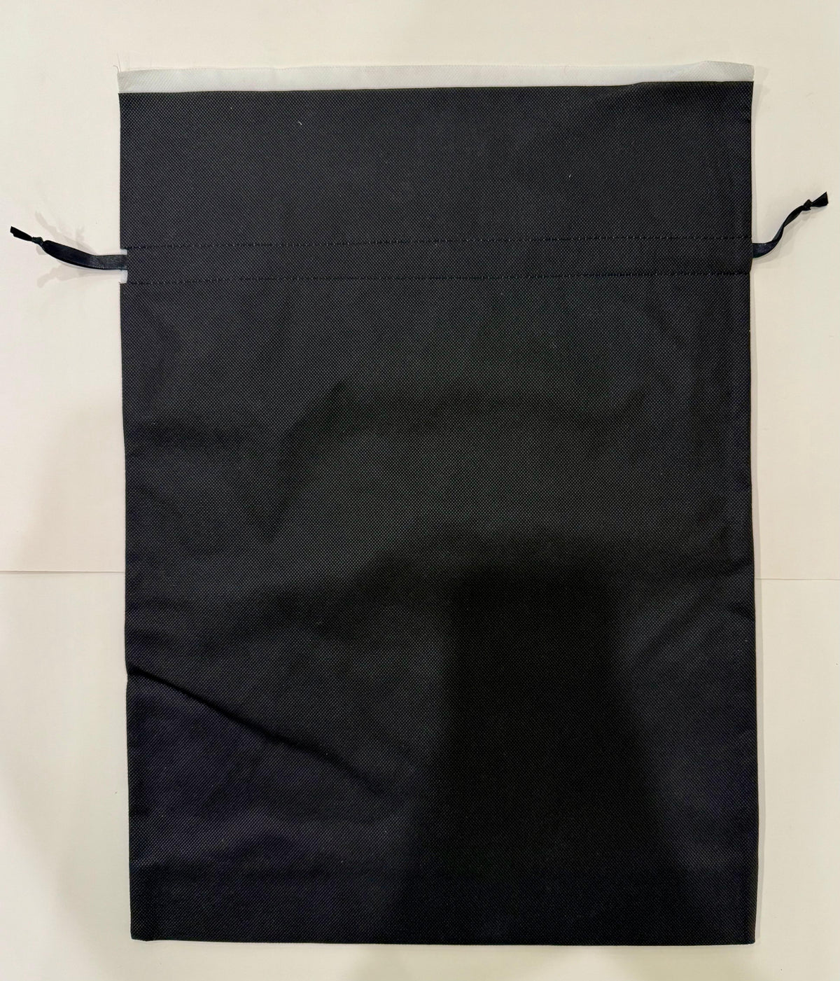 Double edge cotton gift bag with drawstring closure in neutral beige