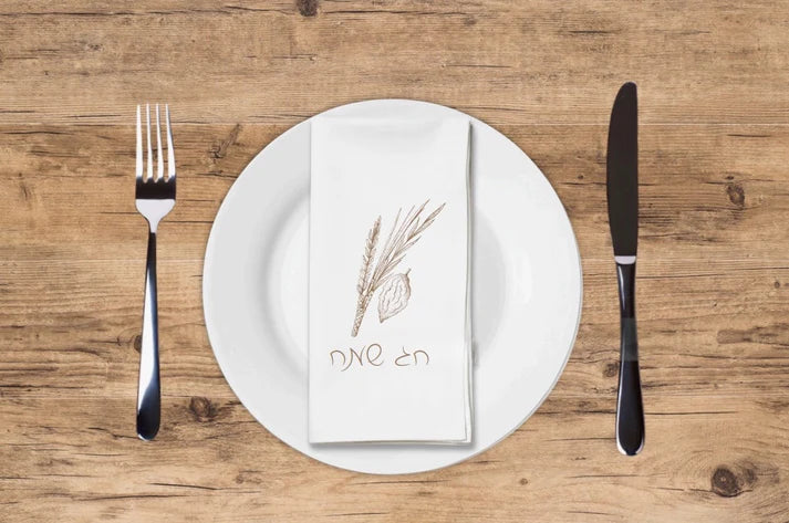 Tan paper napkins with Chag Sameach Hebrew text design for holiday celebrations