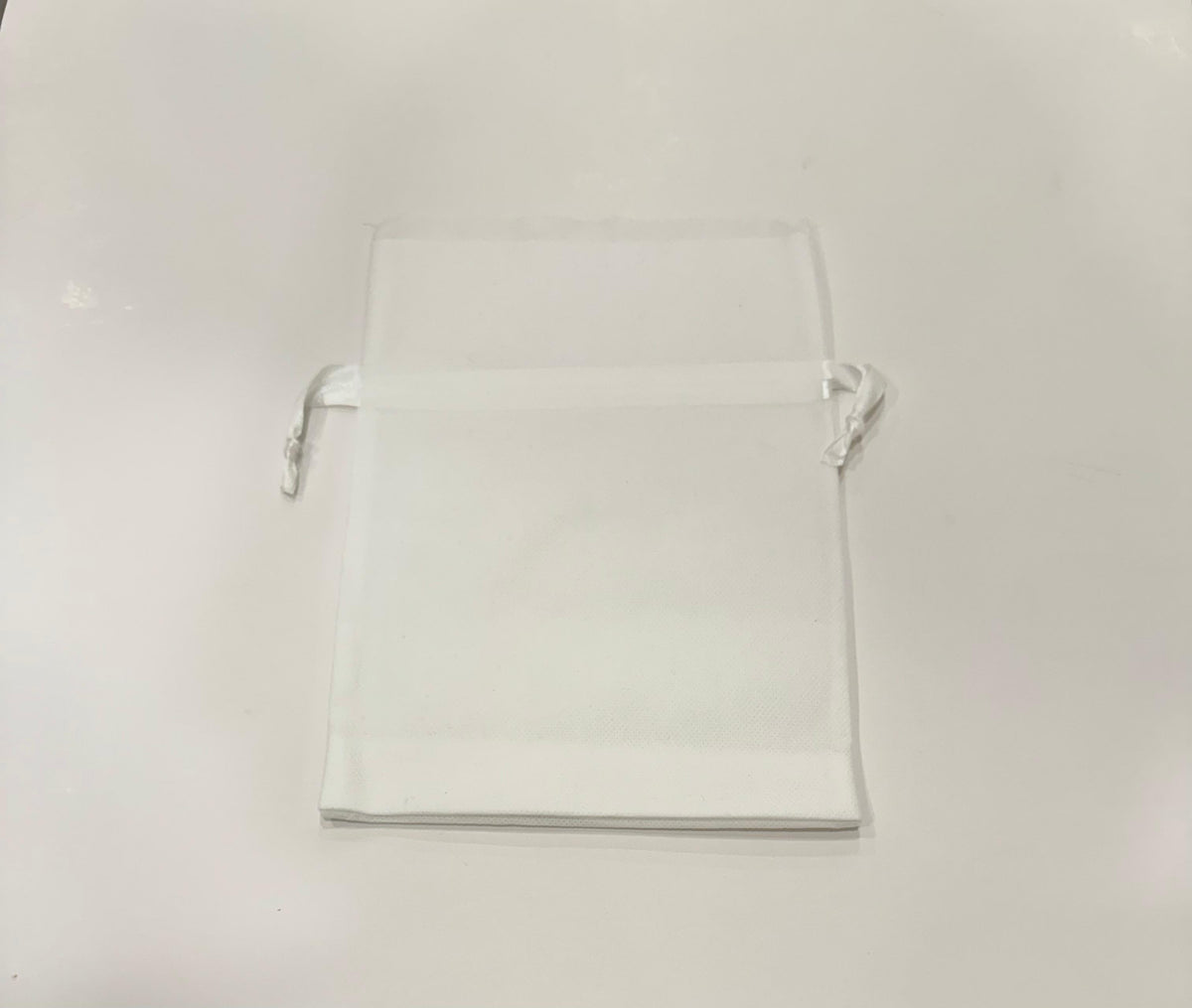 Double edge cotton gift bag with drawstring closure in neutral beige tone