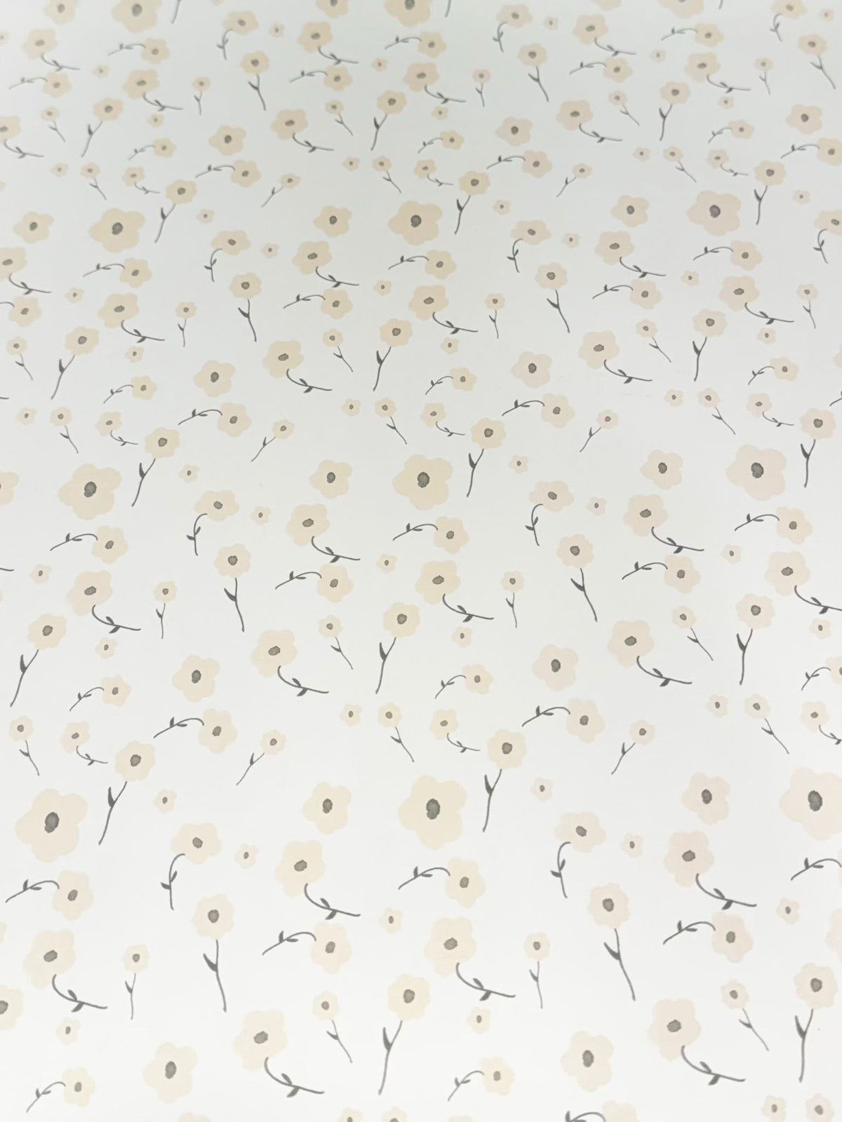 Cream colored gift wrap sheet with delicate floral floret pattern design