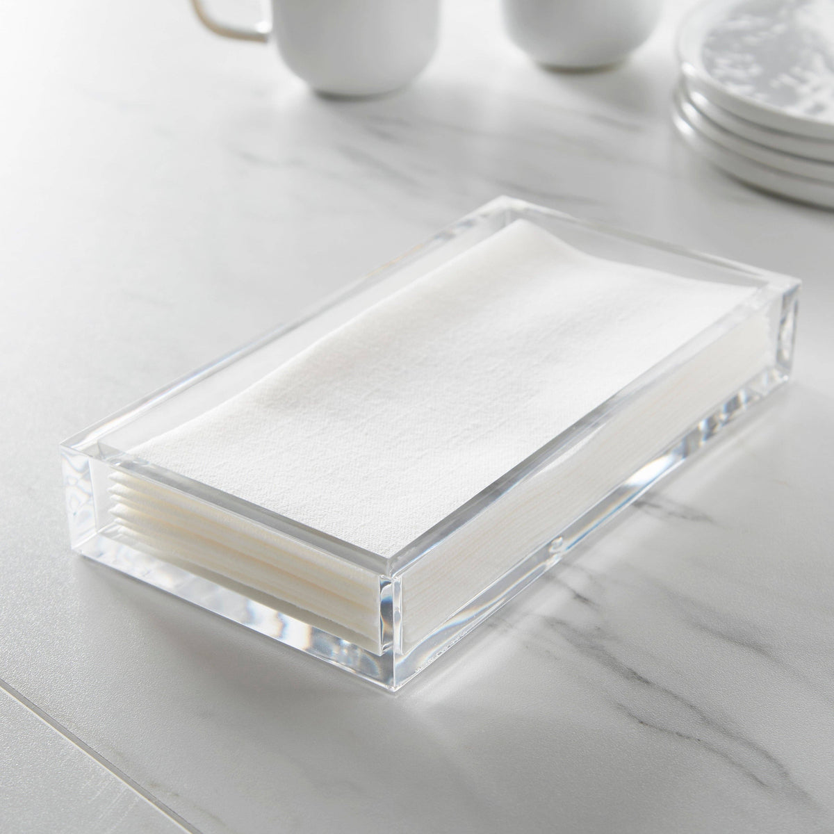 Clear acrylic napkin holder with open top design for table storage