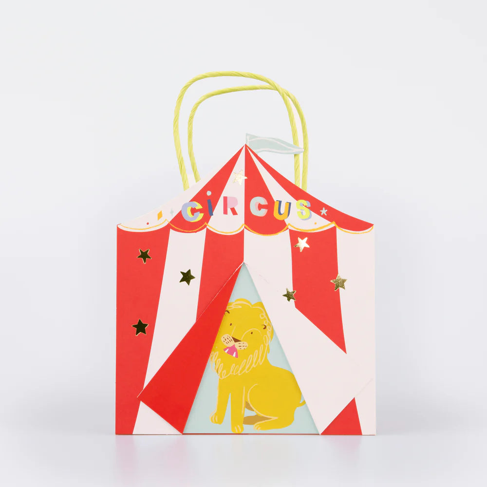 Colorful circus-themed party favor bags with striped patterns and circus designs for children's birthday celebrations