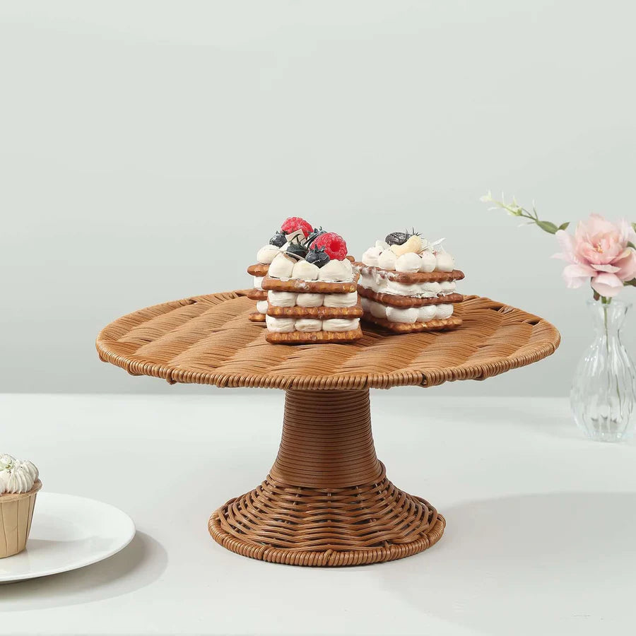 Rattan wicker pedestal cake stand with natural tan weave and raised circular platform