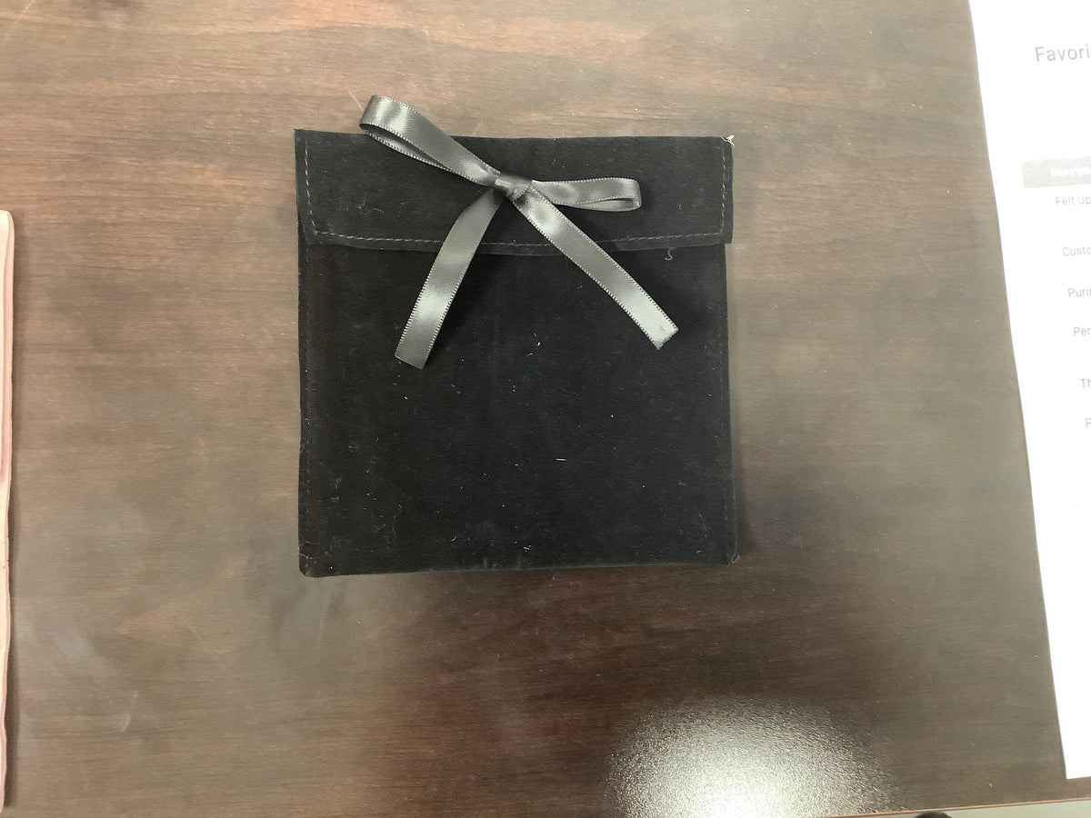 Black suede ribbon pouch with decorative silver-tone snap closure, 5 inch size