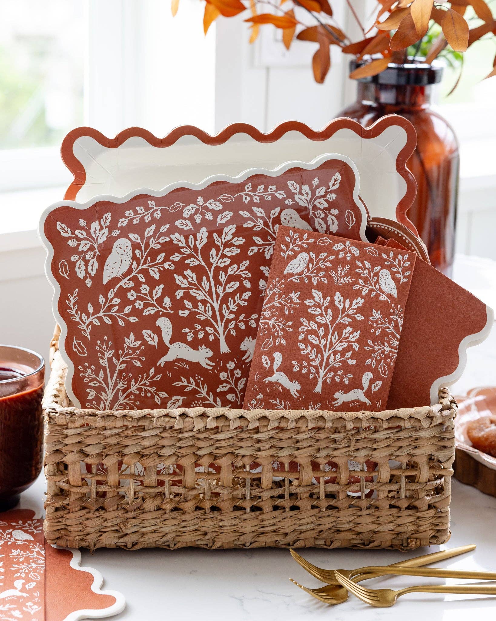 Rust-colored ric rac patterned paper plates with decorative wavy edges displayed in a stack