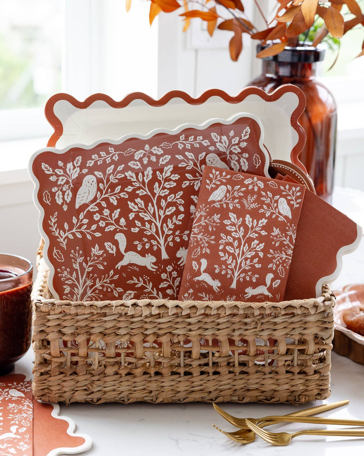 Rust-colored ric rac patterned paper plates with decorative wavy edges displayed in a stack