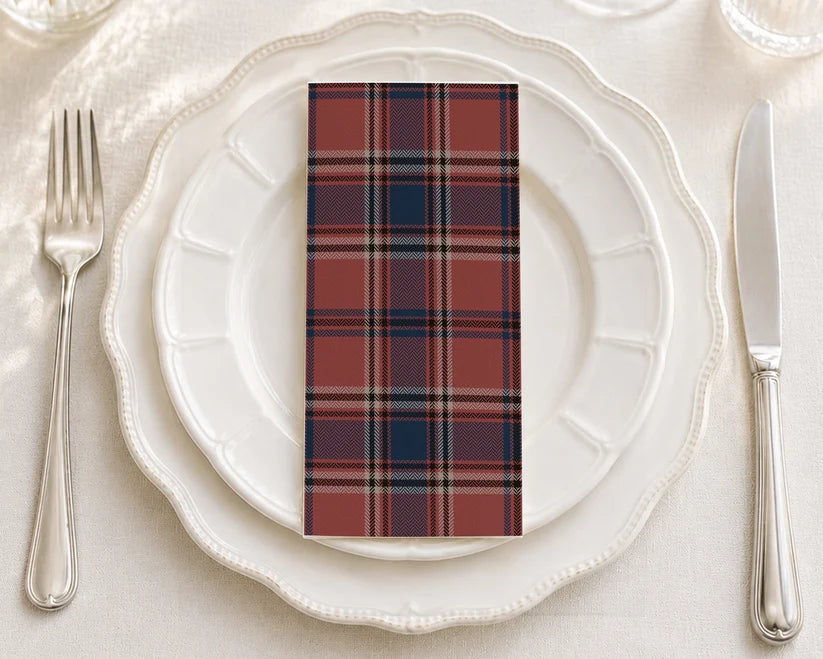 Brick red plaid patterned paper napkin with folded edge detail