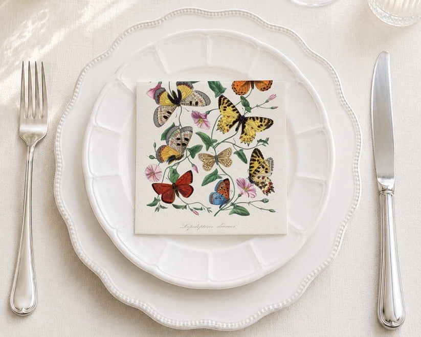 Butterfly moth painting design on white paper napkins with detailed watercolor-style wings