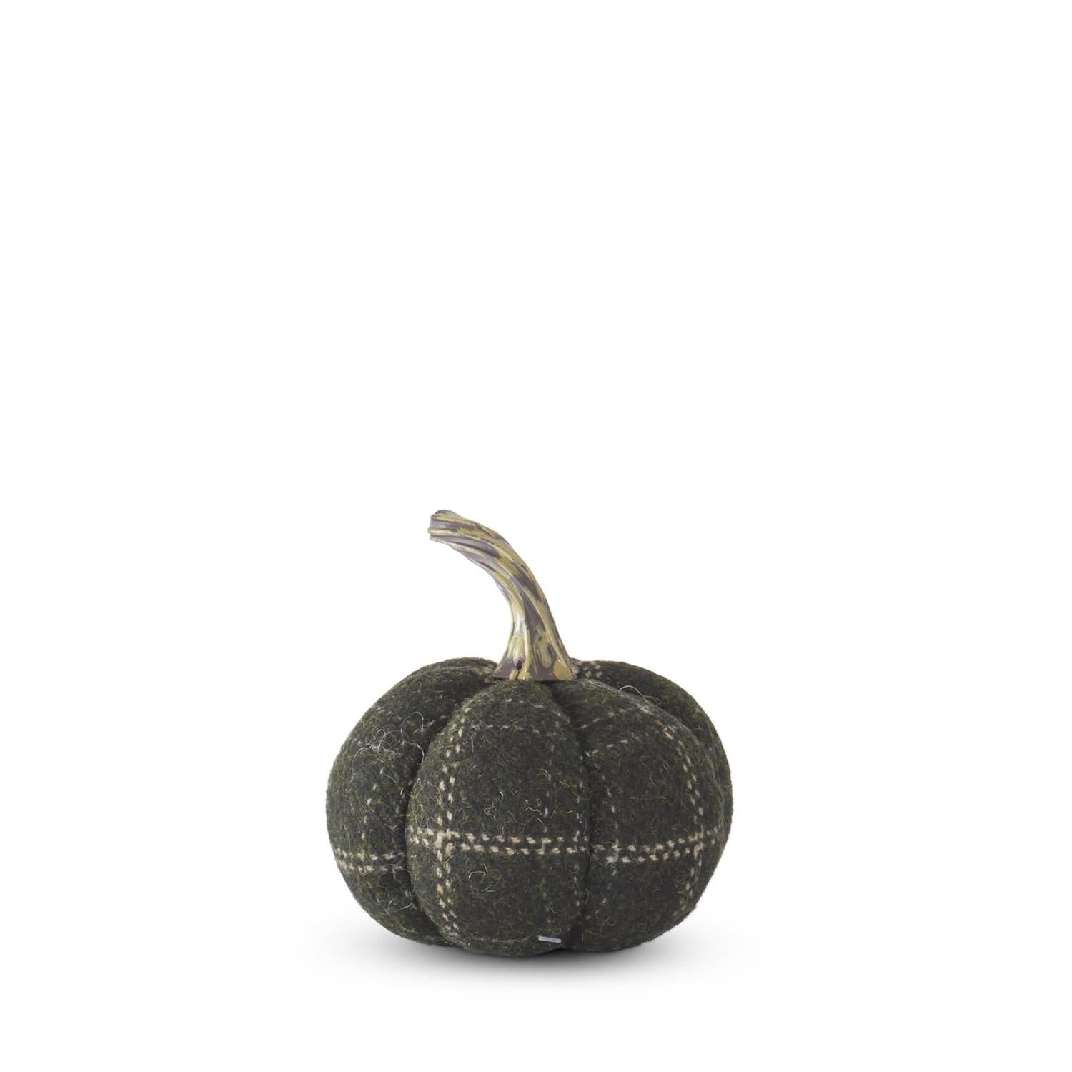 Small decorative pumpkin with a plaid pattern. Elegant table decor at le fete