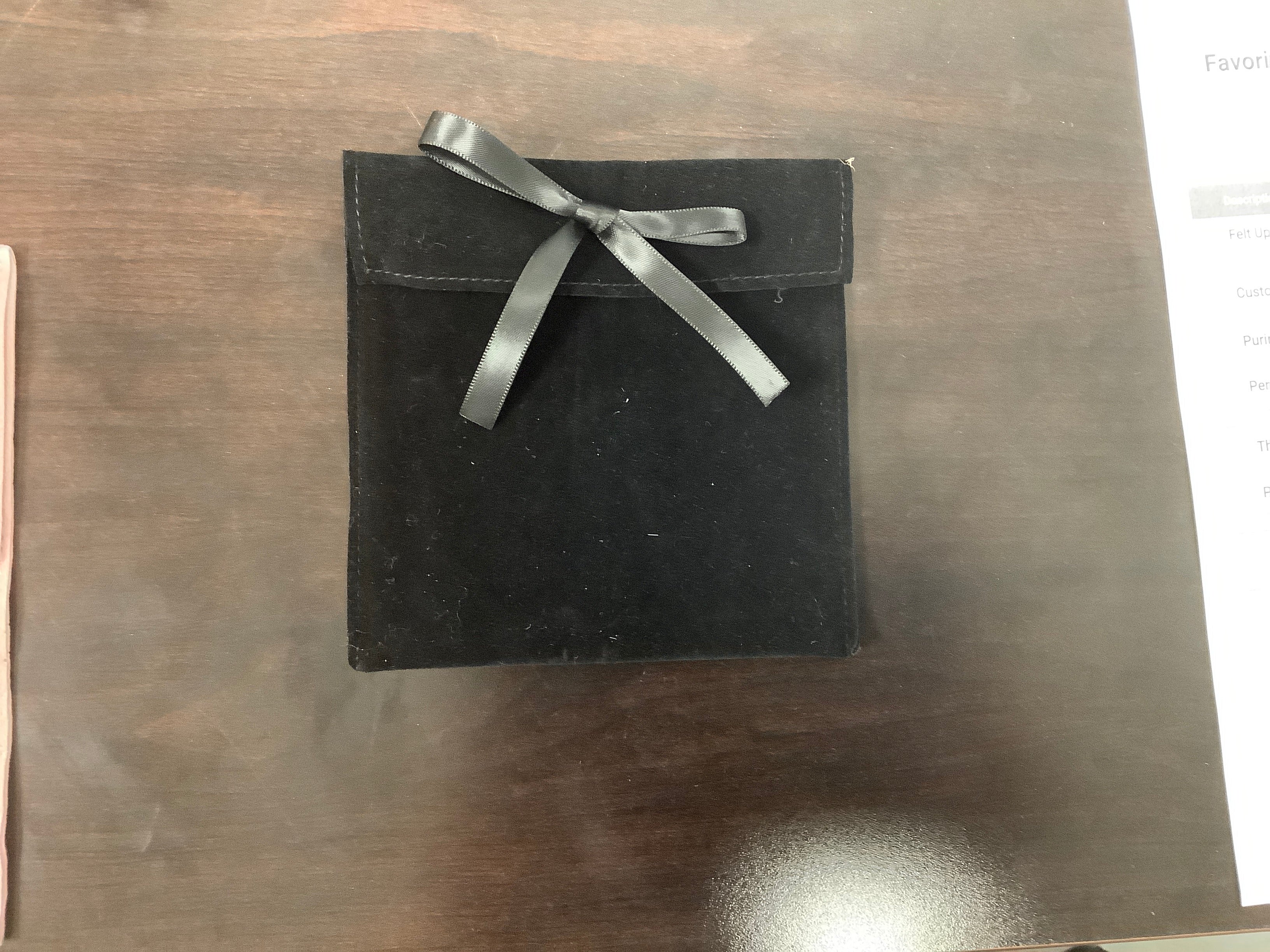 Black suede ribbon pouch with decorative silver-tone snap closure, 5 inch size